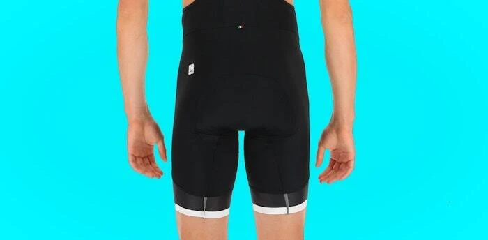 Rear view of black cycling bib shorts with white leg trim