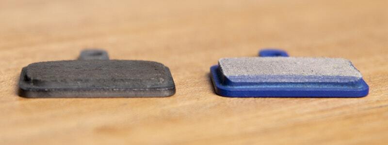 Side view comparison of old and new disc brake pads