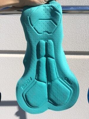 Turquoise cycling chamois with high-density padding and detailed ergonomic contours