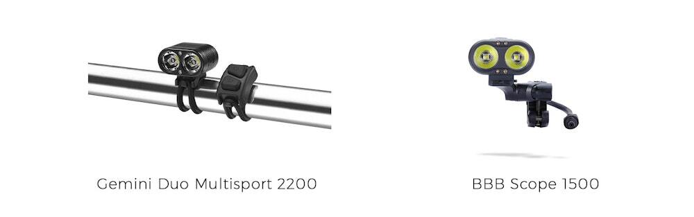 Two bicycle front lights the Gemini Duo Multisport 2200 mounted on handlebars with dual lenses and the BBB Scope 1500 with dual round yellow lenses