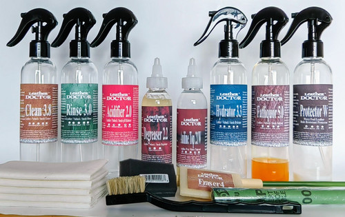 The Aniline Leather Satin Waxy Topcoat Refinishing Kit AX6.tc by Leather Doctor is designed to degrease, clean, rinse, hydrate, soften, and protect leather with a satin waxy topcoat. Before use, mix it with distilled water.