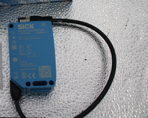 SICK 
 SICK 
 SICK 
 SICK 
 SICK 
 www. SICK.co 
 A.com 
 DE-79183 Waldkirch 
 made in 
 CE ZA EHL 
 Made in Germany XY 
 @ cick.com 
 pid.sick.com 
 SICK WWW. 
 P/N 1221947/ 
 (UL US 
 S/N 22520505 
 LISTED 
 ND. CONT. EQ. 
 .com 
 RAY26P-34162530A00 
 SICK 
 SICK 
 SICK www.SIO 
 SICK 
 SICK www.S 
 SICK 
 SICK 
 w. SICK.com 
 SICK 
 &K.com SICK www.SICK.com 
 SICK 
 RAY26P-34162530A00 
 1 221 947 
 DID8389144 
 DC10 ... 30V 60°C 
 100759401 
 BN 1 + (L+) 
 Gr& Legacy # / CRef: 
 WH2 MF 
 RAY26P-34162530A00 
 BU 3 (M) 
 Default: ME. 
 25 
 PHOTOEYE - MULTITASK PHOTOELECTRIC SENSORS REFLEX 
 100759401 
 SICK AG 
 Erwin Sick Str. 1. 
 D-79183 Waldkirch 
 ARRAY, 5MM MDO - 1221947 
 Made in Germany 
 LE CE