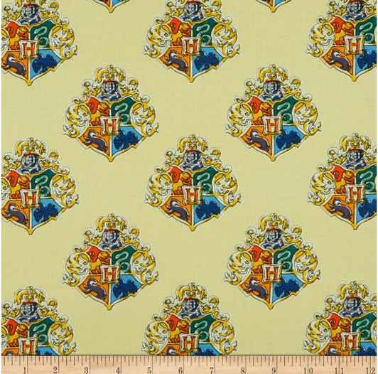 Harry Potter Watercolour Crest Yellow Cotton Quilting Fabric Harry Potter Watercolour Crest Yellow Cotton Quilting Fabric