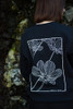 Unisex Flower Sweatshirt with large flower print on the back in black.