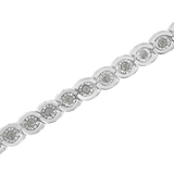 Women's .925 sterling silver link bracelet featuring 1.0 cttw miracle-set round diamonds arranged in spiraling bezel settings for a sparkling, modern design.