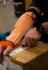 JH orange cut-resistant sleeve with thumb slot — alternate view 3