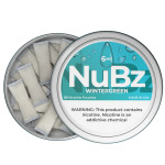 Open can of NuBz Wintergreen 6mg with white nicotine pouches visible beneath the tilted teal lid
