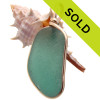 A beautiful piece of deep aqua green sea glass is set in our signature Original Wire Bezel© setting the securely encases the sea glass and leaves it totally unaltered from the way it was found on the beach.

TOP QUALITY CERTIFIED GENUINE SEA GLASS!