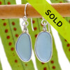 Genuine light blue (sometimes called periwinkle or cornflower blue) is set in our Deluxe Wire Bezel© setting that leaves the sea glass pieces UNALTERED from the way they were found on the beach.
A lovely rare pair of sea glass earrings!