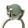 A seafoam green codd marble is set in this solid sterling ring. This is a secure but free floating marble and you will find yourself rotating the marble.......