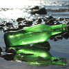 Many green sea glass pieces started as beer bottles discarded into the sea.