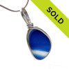 Intense mixed blue sea glass found on the beaches of Seaham England set in our Original Wire bezel© pendant setting in sterling silver.
Sorry this amazing sea glass pendant has sold!