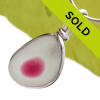 A petite piece of mixed hot pink sea glass from England is set in our Original Wire Bezel© necklace pendant setting.