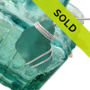 Vivid aqua sea glass from Spain set in a sterling triple necklace pendant setting.