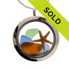 Sea glass in jeweltone colors of green, amber and blues combined with a real starfish and beach sand in this one of a kind stainless steel locket necklace.
 Sorry this piece has SOLD!