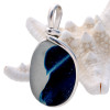 Top quality sea glass in a shade of VIVID deep inky blue and clean pure white.

This is a prized piece of End Of Day Sea Glass from England and comes fully certified as to quality, origin and color value. 