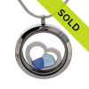 Blue sea glass pieces combined a large silver heart in this sea glass locket necklace.
SORRY THIS LOCKET HAS BEEN SOLD!