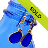 Petite cobalt blue sea glass pieces set in our Original Wire Bezel© earring setting in 14K goldfilled sea glass earrings.

These sea glass pieces are UNALTERED from the way they were found on the beach. TOP QUALITY GENUINE SEA GLASS!