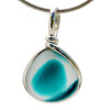 Intense mixed teal or aqua sea glass found on the beaches of Seaham England set in our Original Wire bezel© pendant setting in sterling silver.
