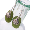 A perfect match of beach found UNALTERED sea glass set with sterling shell charms on fishook earwires.
A lovely pair of earrings for any time of year!
