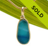 A stunning mixture of tropical aqua and blue in this one of a kind English art sea glass piece. It is set in 14K Rolled Gold in our Original Wire Bezel© setting. Guaranteed for a lifetime of enjoyment!