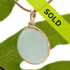 With just a hint of green, this pale seafoam sea glass pendant is set in our Original Wire Bezel© setting. This setting leaves the Victorian era sea glass TOTALLY unaltered from the way it was found on the beach!