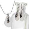 Pure white sea glass in a silver set of earring and matching pendant with silver flip flop charms.