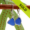 A beautiful pair of natural vivid blue beach found sea glass pieces set in our Original Wire Bezel© setting that leaves the sea glass TOTALLY UNALTERED from the way it was found.
This pair comes on our best grade leverback as shown.
Sorry this pair of sea glass jewelry has been sold