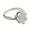 A perfect piece of pure white beach found sea glass set in a solid sterling silver 6 prong ring.