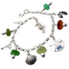 5 pieces of jewel tone sea glass in greens and amber combined with beachy charms in a totally solid sterling silver bracelet.