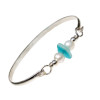 Vivid mixed aqua beach found sea glass combined with real cultured pearls on this solid sterling silver half round sea glass bangle bracelet.