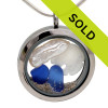 Cobalt Blue beach found sea glass are combined with a small sandollar and a real stick pearl in this one of a kind sea glass locket necklace.
SORRY THIS LOCKET HAS SOLD