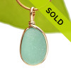 A perfect piece of aqua green with in our signature Original Wire Bezel© pendant setting that leaves both front and back open and the glass unaltered from the way it was found on the beach.
Sorry this piece is no longer available!