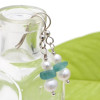 Chunky pieces of aqua are combined with AAA fresh water pearls in this summery pair of sea glass earrings.