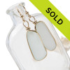 Large and LONG natural UNALTERED white sea glass earrings set in our Original Wire Bezel© setting.
Sorry this sea glass jewelry item is no longer available!