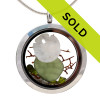 Vivid Peridot Green sea glass combined with a real sandollar, and beach sand and brightened up with a ton of peridot gems. 
Great choice for an August Birthday!
Sorry this jewelry has been sold!