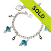 4 pieces of genuine beach found sea glass in a flashed aqua blue and white on a totally solid sterling silver bracelet finished with a sterling heart charm.

Sorry this sea glass jewelry piece has been sold!