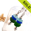 Beautiful Genuine Sea Glass Earrings with glass from England, Hawaii and Puerto Rico shaped ONLY by tide and time.
Bright green, cobalt blue and aqua green sea glass combined with sterling teardrop beads for a polished professional look make this a great pair that will do with many outfits.
SOLD - Sorry these Sea Glass Earrings are NO LONGER AVAILABLE!