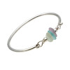 Three pieces of beach found sea glass in yellow, aqua and lavender on this solid sterling silver half round sea glass bangle bracelet.