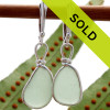 Perfect pieces of all natural genuine sea glass in a bright seafoam green and set in our original Wire Bezel© Sea Glass Earring Setting presented on solid sterling silver leverbacks.
Sorry this pair of sea glass earrings has sold!