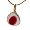 A stunning piece of mixed hot pink and pure white Victorian era sea glass set in gold.