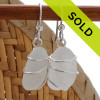 Long and thick beach found sea glass pieces in a versatile pair of sea glass earrings.