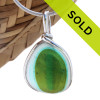 A beautiful larger piece of mixed sea glass with a vivid green and aqua center set for a necklace in our Original Sea Glass Bezel© in solid sterling silver setting.
Sorry this one of a kind sea glass jewelry piece has been sold!