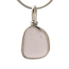 A beautiful piece of surf tumbled sea glass in a silver necklace pendant