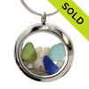 Cobalt Blue, lime green and aqua beach found sea glass  are combined with a small sandollar and fresh water pearls in this one of a kind sea glass locket necklace.

Sorry this sea glass jewelry piece has been sold!