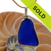 This pendant piece looks to have been the bottom of an old blue jar, maybe Noxzema.
Sorry this sea glass jewelry piece is no longer available.