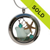 Soft aqua genuine beach found sea glass combined with a real starfish, a bit of seafan and crystal gems, a real underwater scene.
Your own personal Beach-On-The-Go!
Sorry this sea glass jewelry selection has been sold!