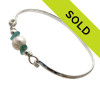 Two aqua sea glass pieces from Hawaii are combined with a LARGE genuine fresh water pearl on a solid sterling bangle bracelet.
Sorry this Sea Glass Jewelry piece has been SOLD!