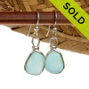 Perfect pieces of naturally collected Carolina Blue sea glass in our ORIGINAL Wire Bezel© setting in Silver.
Sorry these Sea Glass Earrings have been SOLD!