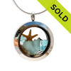Genuine sea glass in tropical aqua, a real baby starfish and a bit of seafan completes this mini sea glass locket necklace.
Sorry this sea glass jewelry piece has been sold!